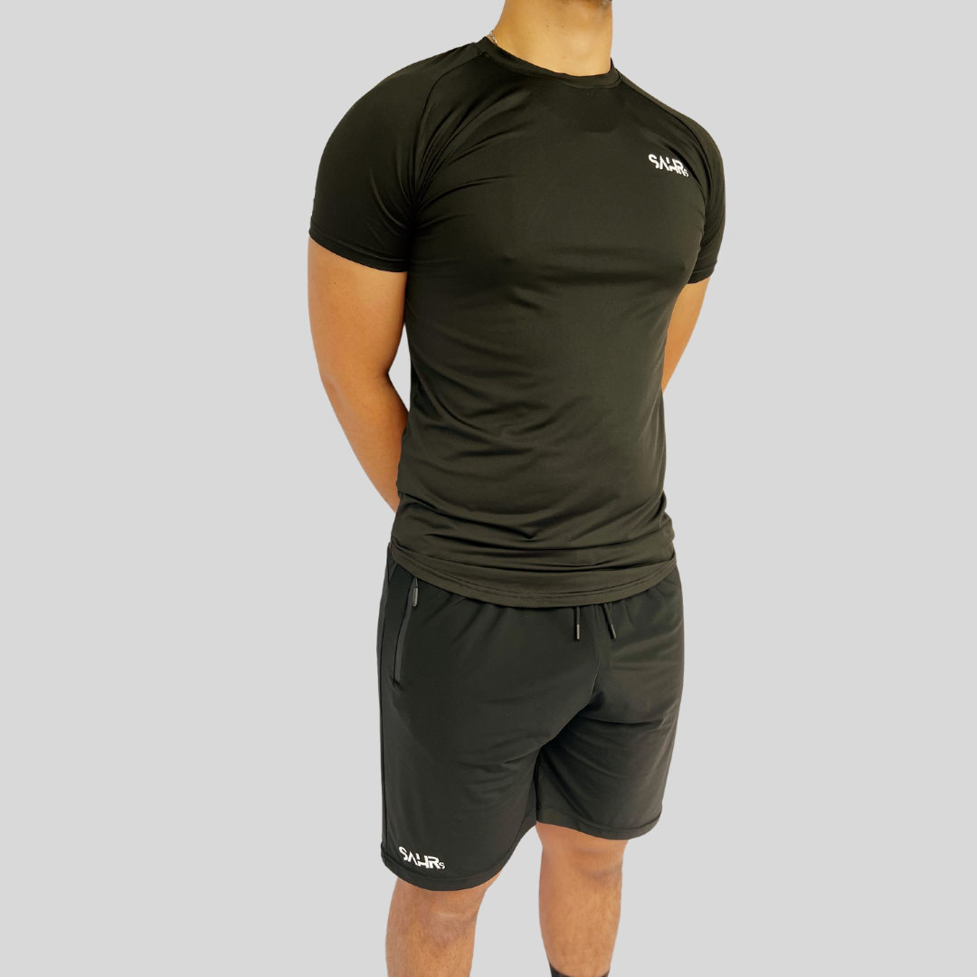 Lightweight mens black short sleeve shirt with breathable fabric, moisture wicking technology, and curved bottom hem