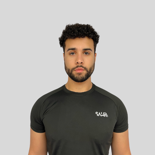 Lightweight mens black short sleeve shirt with breathable fabric, moisture wicking technology, and curved bottom hem