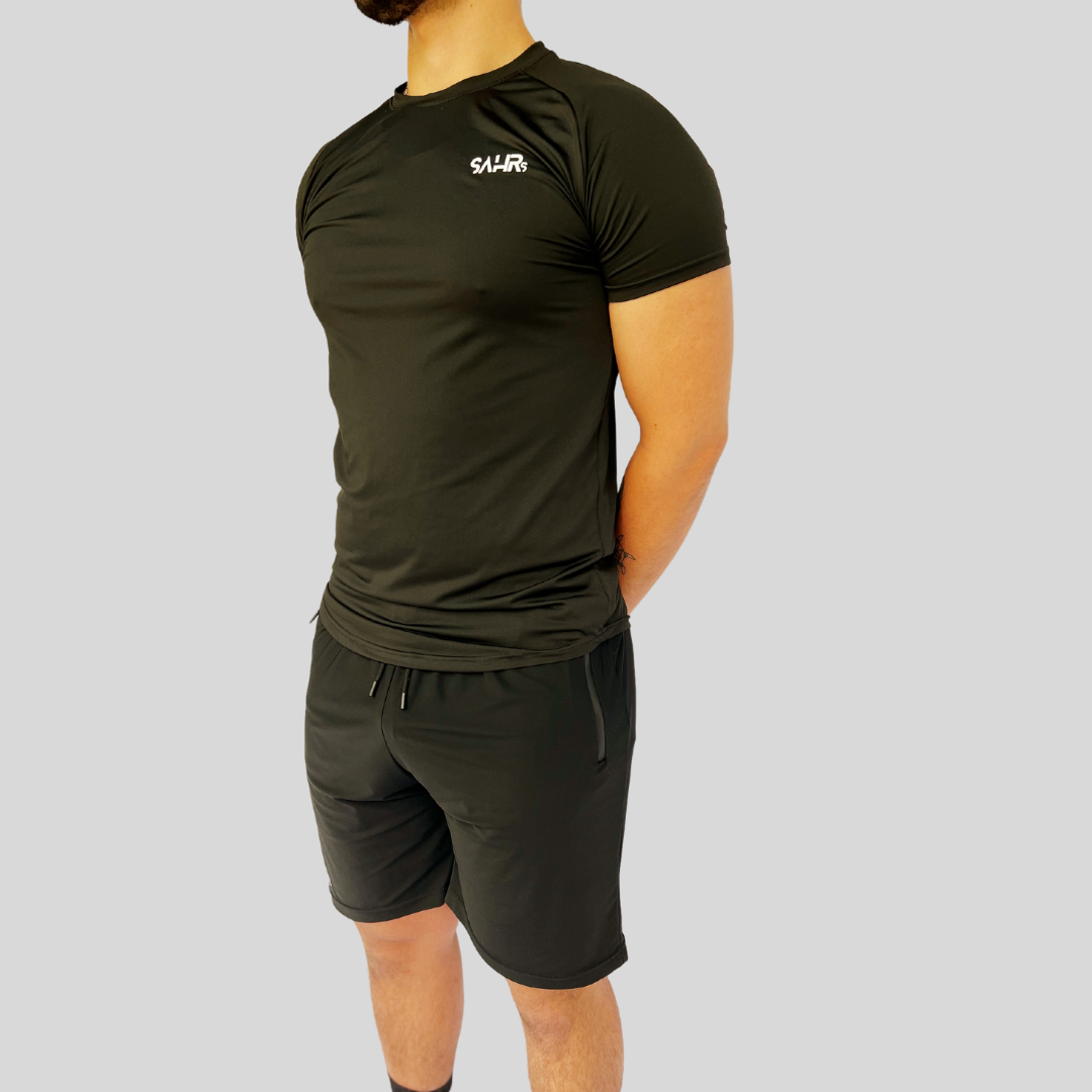 Lightweight mens black short sleeve shirt with breathable fabric, moisture wicking technology, and curved bottom hem