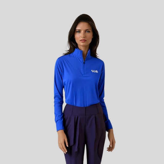 Women's blue fitted top tucked in