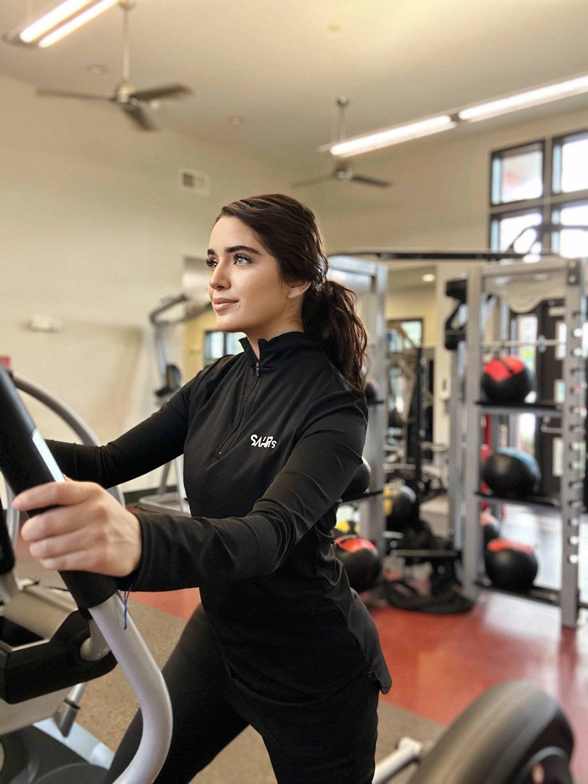 Womens black long sleeve top featuring coolness, courtesy of its rapid-drying and moisture-wicking technology